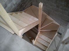 an unfinished staircase being built into the wall