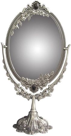 an ornately designed mirror is shown against a white background with the reflection in it