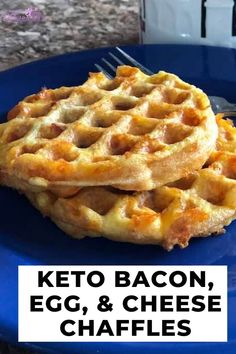 two waffles on a blue plate with the words keto bacon egg and cheese chaffles