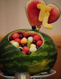 a watermelon shaped like a heart and filled with fruit