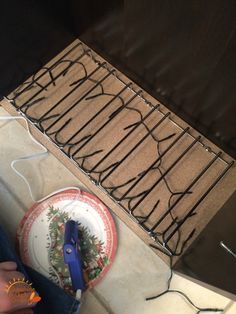 a pair of blue scissors sitting on top of a table next to a paper plate