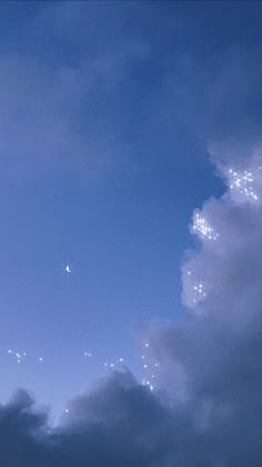 an airplane is flying in the sky with stars on it's tail and some clouds