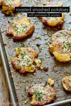 some food is sitting on a baking sheet and ready to be cooked in the oven