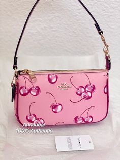 Coach Nolita 19 With Cherry Print Brand new with tags 100% Authentic COME WITH ORIGINAL PACKAGING Color: Flower Pink Product Details Printed coated canvas and smooth leather Two credit card slots Inside multifunction pocket Zip-top closure, fabric lining Chain handle with 6 1/4" drop 7 1/2" (L) x 4 1/2" (H) x 2" (W) Style No. CR827 Price is firm Same day shipping Coach Teri Shoulder Bag, Coach Nolita 19, Coach Nolita, Nolita 19, Girly Bags, Coach Shoulder Bag, Cherry Print, Pretty Bags, Leather Clutch Bags