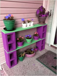 an outdoor shelf with potted plants on it