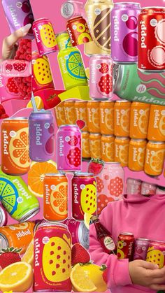 a collage of various soda cans and oranges with the same person holding one