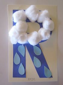 a blue and white paper plate with a wreath made out of cotton balls