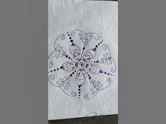 a white paper bag with blue designs on it