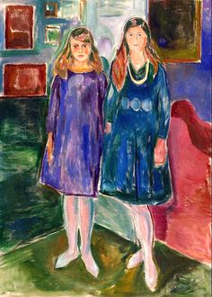 two women standing next to each other in front of a painting on the wall, one woman is wearing a blue dress