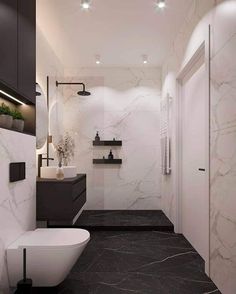 a modern bathroom with black and white marble flooring