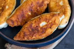 two pieces of fried fish are in a bowl