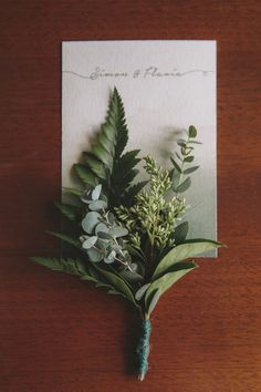 a bouquet of flowers on top of a wooden table