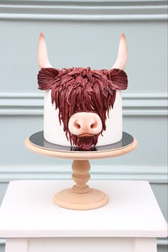 there is a cake with a cow head on it