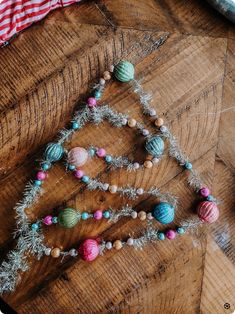 a christmas tree made out of balls on top of a wooden table