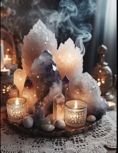 some candles and rocks on a table