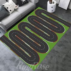 a living room area rug with an image of a road on the floor in front of a couch