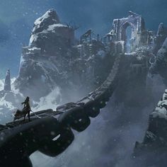 a woman standing on top of a snow covered mountain next to a tall castle in the distance