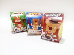 three boxes of milk with cartoon characters on them