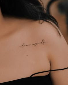 a woman's shoulder with the word love my soul written in cursive font