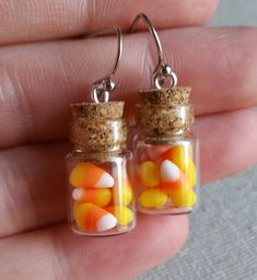 two small glass jars filled with candy corn