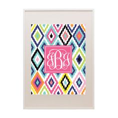 the monogrammed colorful diamond pattern is shown in pink, blue and green with a bright