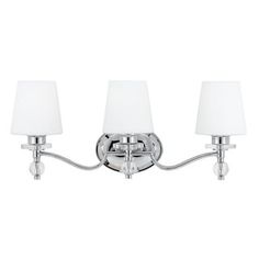 three light bathroom fixture in chrome finish with white linen shades on the lampshades