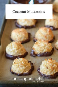 chocolate covered coconut macaroons on a baking sheet with text overlay that reads, coconut macaroons once upon a chef