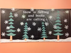 a bulletin board with snow falling and books are calling