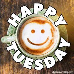 a cappuccino with a smiley face drawn on it's foam in front of the words happy tuesday