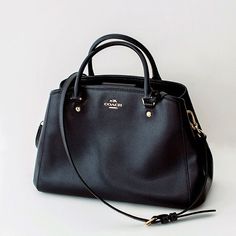 Preowned, excellent pristine condition from a smoke-free home. Coach Margot Small Carryall 34607 Navy/Midnight Blue Leather Satchel with dust bag   Crossgrain leather Inside zip, cell phone and multifunction pockets Zip-top closure, fabric lining Handle with 3 3/4" drop, 13 3/4" (L) x 9" (H) x 6" (W) Strap with 20" drop for shoulder or crossbody wear. New Beginning, Dressing Room, Leather Satchel, Blue Leather, Coach Handbags, Midnight Blue, Carry On, Bags Handbags, Satchel