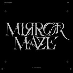 the title for mirror maze, written in black and white with silver lettering on it