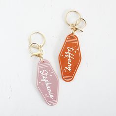 two keychains with the words happy birthday on them