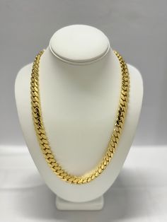 Indulge in the timeless elegance of our Cuban link chains and bracelets, meticulously handcrafted to perfection. Each piece is a solid statement of craftsmanship, created with passion and precision. Our Cuban link collection is plated not once, not twice, but five times with a lavish 14K Gold polish, ensuring a radiant and opulent finish that exudes sophistication. Embrace the uniqueness of handmade jewelry, where each link is carefully assembled to create a one-of-a-kind masterpiece. Our commit Formal Cuban Link Necklace With Curb Chain, Formal Curb Chain Jewelry, Elegant Cuban Link Necklace With Solid Construction, Elegant Cuban Link Necklace With Solid Construction For Formal, Cuban Link Necklace With Oval Links As Gift, Cuban Link Jewelry With Adjustable Chain For Anniversary, Cuban Link Necklace With Oval Links For Gift, Formal Cuban Link Jewelry With Polished Finish, Elegant Cuban Link Necklace With Polished Finish