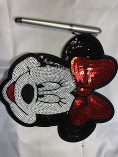 a hello kitty purse with sequins on it