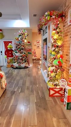 a room decorated with christmas trees and decorations