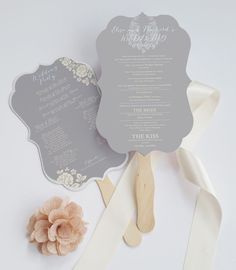 the wedding fan is on display next to ribbon