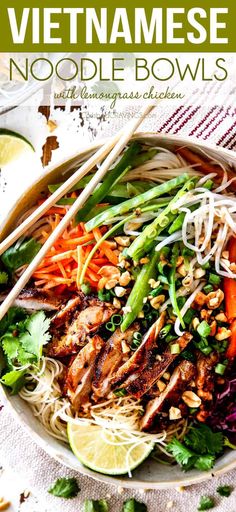 vietnamese noodle bowls with limes, carrots and cilantro in a white bowl