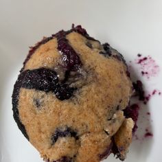 a blueberry muffin is on a white plate