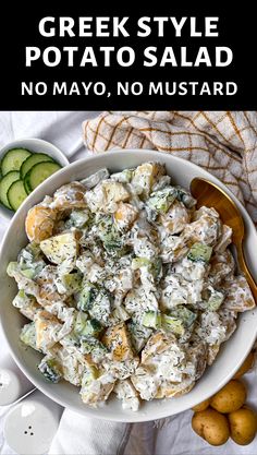 a bowl filled with potato salad next to cucumbers