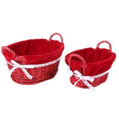 two red baskets with white lace on them