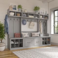 a large white rug in front of a gray and white coat rack with many items on it