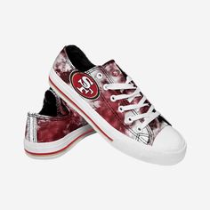 The world is your canvas - Make sure it's a colorful one! Take the next step towards proving you're the grooviest fan around with these San Francisco 49ers Women's Low Top Tie Dye Canvas Shoes! Features Team-colored tie dye design for plenty of funky fresh fandom Team logo display on side and tongue, in case there were any doubts where your allegiances lie Low-top style to make you look good from head to toe Adjustable laces for security, so get ready to lace up Closed, round toe design that wil Dye Canvas Shoes, Dallas Cowboys Shoes, Cowboy Shoes, Nfl Teams Logos, Toes Designs, Tie Dye Designs, Self Service, San Francisco 49ers, Nfl Teams