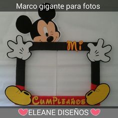 a mickey mouse photo frame with the word'm'in spanish and an image of minnie