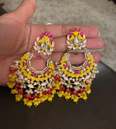 Earrings as seen on the pic Color yellow and gold Dangling drop earrings to go with any color combination  If you have any question feel free to contact me anytime.. thank you Yellow Jhumka, Handmade Gold Kundan Chandelier Earrings, Yellow Latkan Earrings For Party, Yellow Latkans Earrings For Party, Yellow Earrings For Party And Festivals, Yellow Party Earrings With Latkans, Festive Yellow Drop Earrings, Yellow Dangle Earrings For Wedding, Elegant Yellow Earrings For Festivals