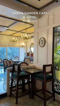 a restaurant with tables and chairs in front of a glass door that leads to an outdoor swimming pool