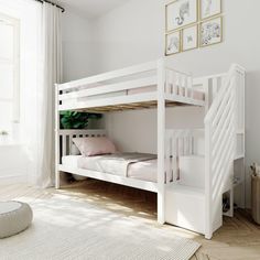 a white bunk bed sitting next to a window in a room with wooden flooring