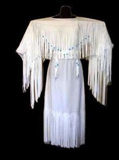 Accents: Fringes. Outer Shell Material: Grade 'A' Real Cowhide Leather. Sewing Thread: Heavy-duty top-stitching strong thread. Wear: Maxi, Jacket Coat, Dress. Colour: White. Seasons: Fall, Spring & Winter. Native American Wedding Dress, Buckskin Dress, American Wedding Dress, American Indian Clothing, Native Clothing, Native Beauty, Native American Wedding, Native American Dress, Wedding Dresses Indian