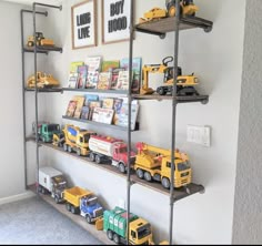 there are many toy trucks on the shelves in this child's playroom area