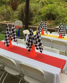 tables with checkered flags are set up for an event