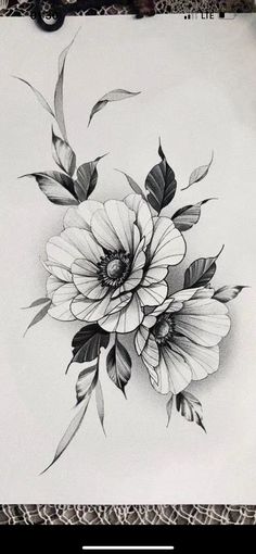 a black and white drawing of flowers on paper